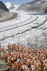 Living sculpture: hundreds of naked volunteers express the vulnerability of glaciers and human life in a warming world.